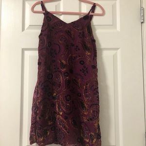 Maroon/purple dress with velvet design.